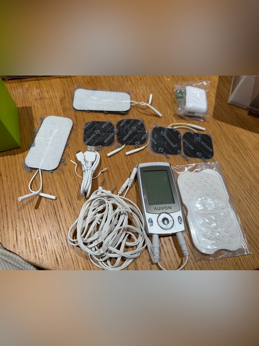 White TENS Unit with Electrode Pads and Cables